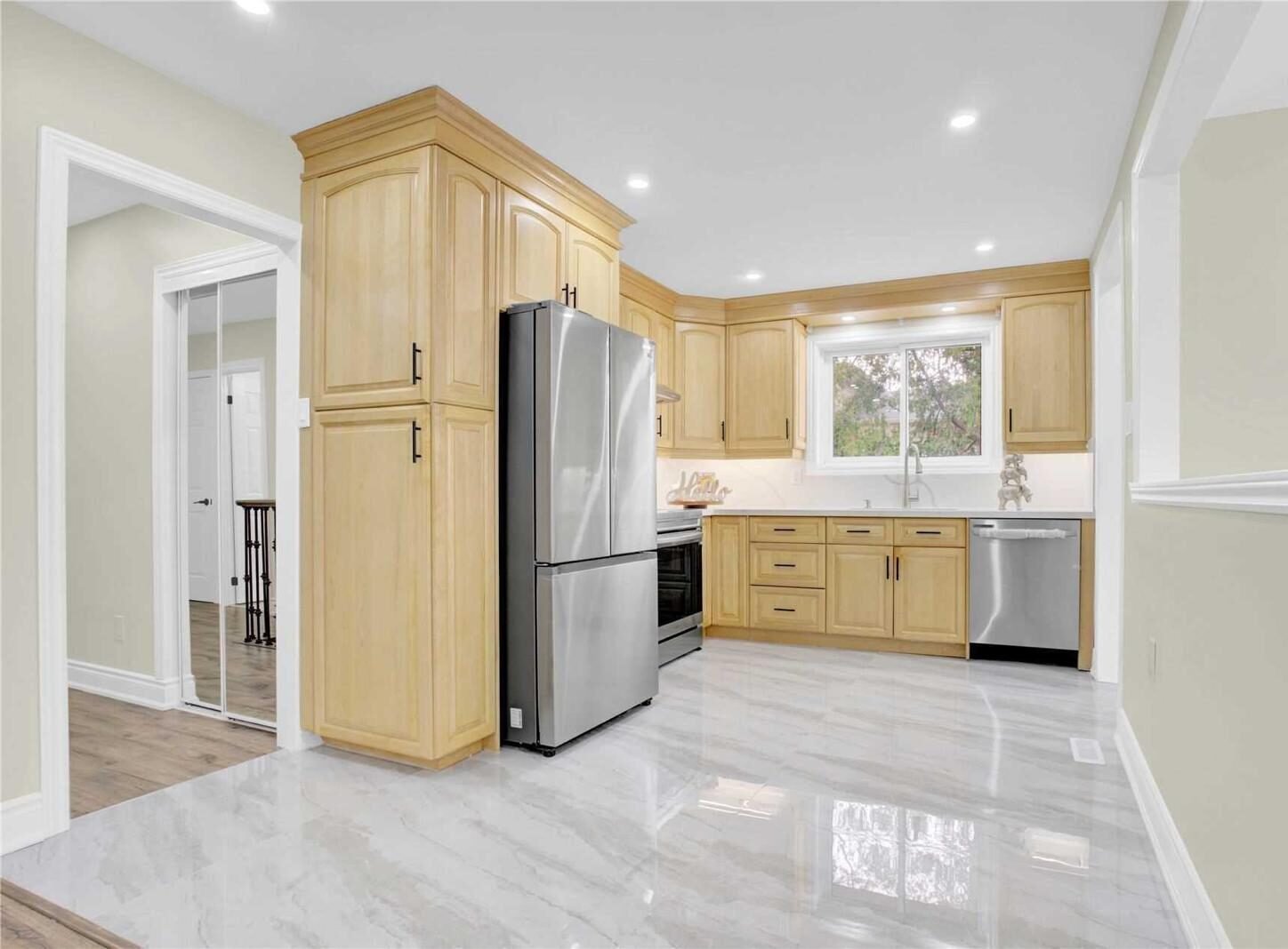 Custom kitchen renovation with island and stone countertops