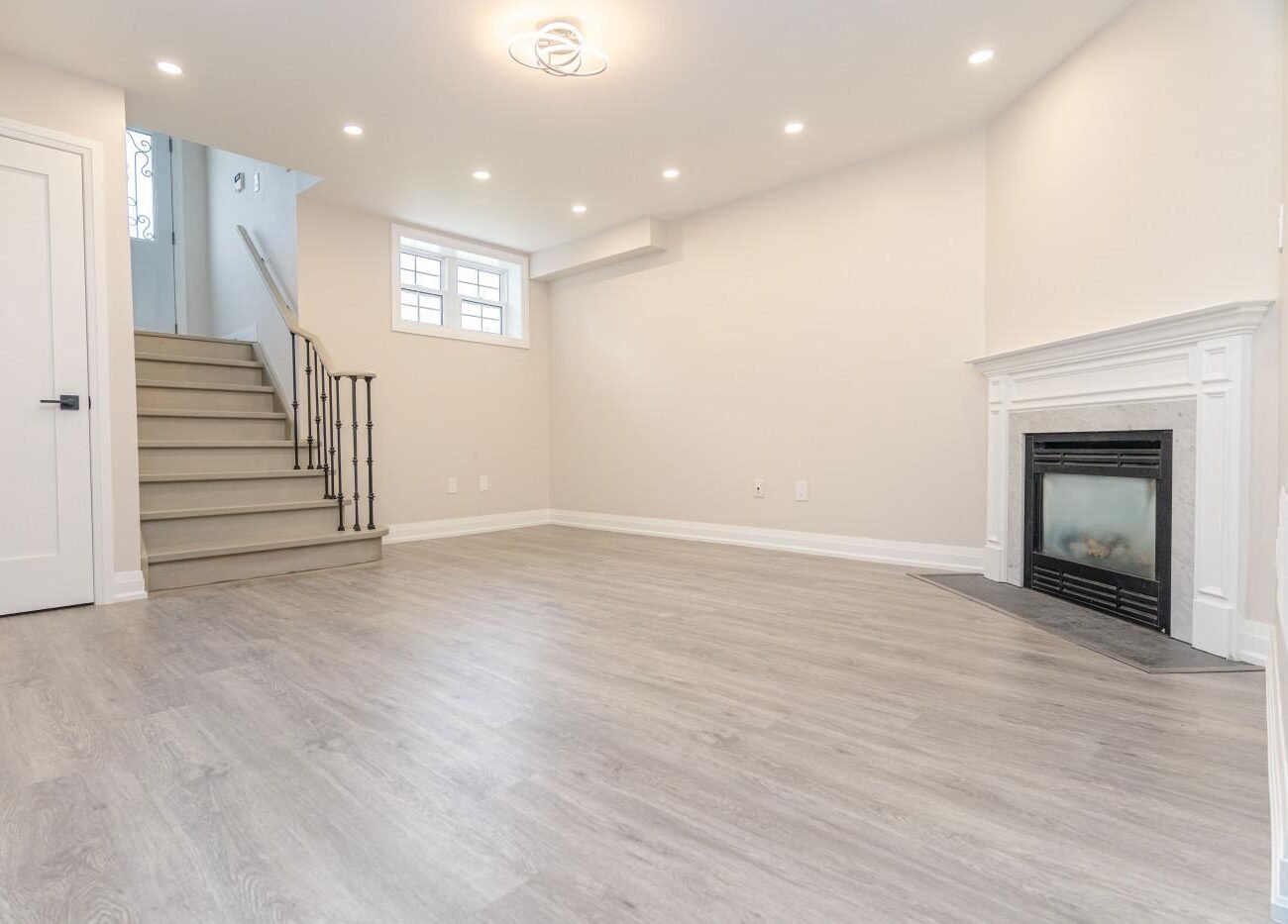 Finished basement with recessed lighting and living area